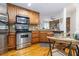 Well-equipped kitchen featuring stainless steel appliances and a cozy breakfast nook at 5401 Bentgrass Dr # 1-113, Sarasota, FL 34235