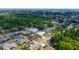 A high angle view of the property showing a screened-in pool and mature landscaping at 5613 Sweetwater Oak Dr, Sarasota, FL 34232