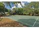 Well-maintained basketball court where children are playing and enjoying the outdoor recreational space at 5613 Sweetwater Oak Dr, Sarasota, FL 34232