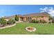 Beautiful one-story home with a well-manicured lawn and landscaping creating great curb appeal at 5613 Sweetwater Oak Dr, Sarasota, FL 34232