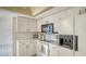 Bright kitchen features white appliances and cabinets providing ample storage and meal prep space at 5613 Sweetwater Oak Dr, Sarasota, FL 34232
