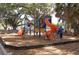 Vibrant playground with play structures, slides, and ample space for to play and socialize in a safe environment at 5613 Sweetwater Oak Dr, Sarasota, FL 34232