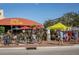 Charming outdoor dining at Mattison's City Grille with umbrellas and bicycle parking at 5613 Sweetwater Oak Dr, Sarasota, FL 34232
