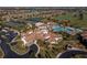 Aerial view of the community's clubhouse, pool, tennis courts, and surrounding landscape at 5624 Palmer Cir # 206, Bradenton, FL 34211