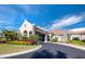 Beautiful clubhouse exterior with lush landscaping and a grand entrance at 5624 Palmer Cir # 206, Bradenton, FL 34211