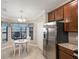 Modern kitchen with stainless steel appliances and a breakfast nook with views at 5624 Palmer Cir # 206, Bradenton, FL 34211