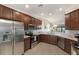 Modern kitchen with stainless steel appliances, granite countertops, and open floor plan at 5624 Palmer Cir # 206, Bradenton, FL 34211