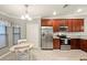 Well-equipped kitchen with stainless steel appliances and a breakfast nook area at 5624 Palmer Cir # 206, Bradenton, FL 34211