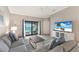 Cozy living room with access to a balcony that overlooks beautiful golf course and water views at 5624 Palmer Cir # 206, Bradenton, FL 34211