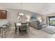 Bright, open concept living space with dining area, living room and balcony access at 5624 Palmer Cir # 206, Bradenton, FL 34211