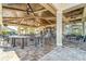 Beautiful covered patio area with comfortable seating and stylish bar at 5624 Palmer Cir # 206, Bradenton, FL 34211