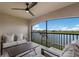 Relaxing covered patio with comfortable seating and a serene lake view at 5624 Palmer Cir # 206, Bradenton, FL 34211