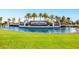 Lakewood National entrance sign surrounded by water, lush lawn, and palm trees at 5624 Palmer Cir # 206, Bradenton, FL 34211