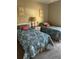 Bright bedroom with twin beds adorned with colorful patterned bedding at 6108 7Th W Ave # 6108, Bradenton, FL 34209