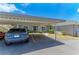 Exterior view with covered parking and landscaped grounds at 6108 7Th W Ave # 6108, Bradenton, FL 34209