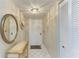Inviting foyer with a white tile floor, mirror and coat closet at 6108 7Th W Ave # 6108, Bradenton, FL 34209