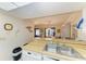 Functional kitchen sink with wooden counters and an open view to dining area at 6108 7Th W Ave # 6108, Bradenton, FL 34209