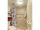 A bathroom shower with a pebbled floor and grab bars at 6108 7Th W Ave # 6108, Bradenton, FL 34209