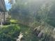 Private backyard with lush greenery, offering a serene and natural setting at 669 Spanish N Dr # 21, Longboat Key, FL 34228
