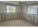 Bedroom ready for renovation, featuring a ceiling fan and windows offering natural light at 669 Spanish N Dr # 21, Longboat Key, FL 34228