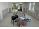Bright living room ready for renovation with a sliding glass door providing access to the outdoors at 669 Spanish N Dr # 21, Longboat Key, FL 34228