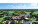 Aerial view of the golf course clubhouse and surrounding neighborhood at 6914 Dominion Ln, Lakewood Ranch, FL 34202