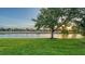 Serene backyard features mature trees and a tranquil pond at 6914 Dominion Ln, Lakewood Ranch, FL 34202