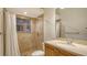 This bathroom features a shower with a window, a single sink vanity, and tiled floors at 6914 Dominion Ln, Lakewood Ranch, FL 34202