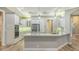 Modern kitchen with white cabinets, stainless steel appliances, and lots of counter space at 6914 Dominion Ln, Lakewood Ranch, FL 34202