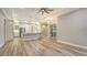 Open floor plan living room and kitchen with lots of natural light and wood floors at 6914 Dominion Ln, Lakewood Ranch, FL 34202