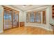 Bright office space with hardwood floors, natural light from the windows, and custom wood shutters and built-ins at 6914 Dominion Ln, Lakewood Ranch, FL 34202