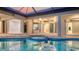 Beautiful pool and spa surrounded by a covered patio with multiple access points at 6914 Dominion Ln, Lakewood Ranch, FL 34202