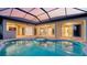 Beautiful pool and spa surrounded by a covered patio with multiple access points at 6914 Dominion Ln, Lakewood Ranch, FL 34202