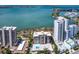 Aerial view of the condo community with a pool and water views at 707 S Gulfstream Ave # 301, Sarasota, FL 34236