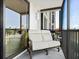 Cozy screened-in balcony with comfortable seating, perfect for enjoying the outdoors at 707 S Gulfstream Ave # 301, Sarasota, FL 34236