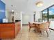 Open common area with a bar, dining table, and access to outdoor amenities at 707 S Gulfstream Ave # 301, Sarasota, FL 34236