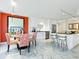 Stylish dining area with modern chairs, white cabinets, and stainless steel appliances at 707 S Gulfstream Ave # 301, Sarasota, FL 34236