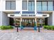 Grand entrance to Essex House with manicured landscaping and elegant architectural details at 707 S Gulfstream Ave # 301, Sarasota, FL 34236