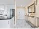 Welcoming foyer with modern console, leading to a bright, updated kitchen at 707 S Gulfstream Ave # 301, Sarasota, FL 34236