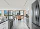 Modern kitchen with stainless appliances and marble floors, opens to dining area at 707 S Gulfstream Ave # 301, Sarasota, FL 34236