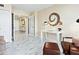 Open living room with marble floors, french doors, desk and modern decor at 707 S Gulfstream Ave # 301, Sarasota, FL 34236
