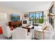 Inviting living room with comfortable seating, fireplace, and scenic views at 707 S Gulfstream Ave # 301, Sarasota, FL 34236