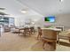 Inviting living room area featuring comfortable seating, a TV, and serene decor at 707 S Gulfstream Ave # 301, Sarasota, FL 34236