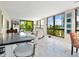Spacious living room with floor-to-ceiling windows, marble floors, and access to the balcony at 707 S Gulfstream Ave # 301, Sarasota, FL 34236