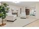 Cozy living room area with patterned chairs, a glass table, and a bookshelf at 707 S Gulfstream Ave # 301, Sarasota, FL 34236