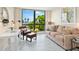Well-lit living area featuring a comfortable seating area and a large window with a scenic view at 707 S Gulfstream Ave # 301, Sarasota, FL 34236