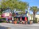 Inviting restaurant exterior with outdoor seating and colorful awnings at 707 S Gulfstream Ave # 301, Sarasota, FL 34236