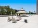 Expansive rooftop terrace with a gazebo, outdoor seating, and a pool view at 707 S Gulfstream Ave # 301, Sarasota, FL 34236