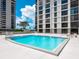 Inviting community swimming pool with clear blue water and sun loungers at 707 S Gulfstream Ave # 301, Sarasota, FL 34236