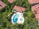 Community pool and lounge with lush greenery and serene atmosphere at 7331 Villa D Este Dr, Sarasota, FL 34238